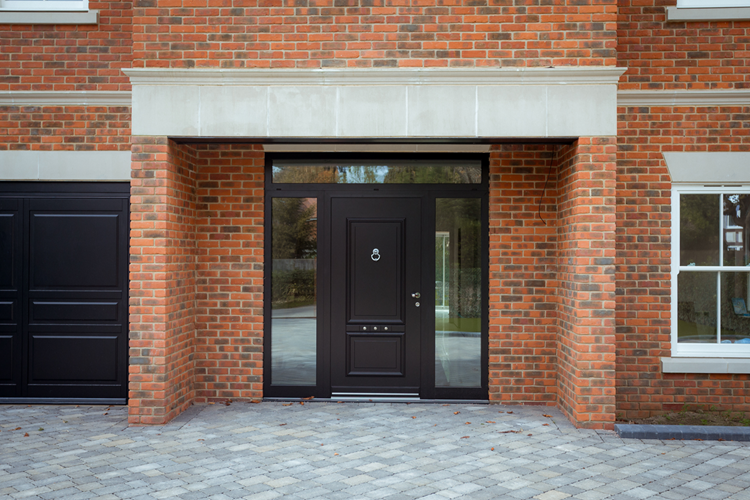 Traditional black front door in oversized opening 